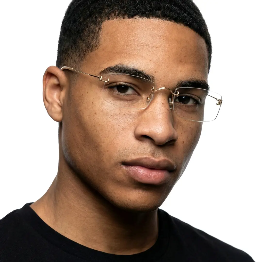 Three-quarter view of male wearing gold rectangle eyeglasses, neutral expression, ET0292601