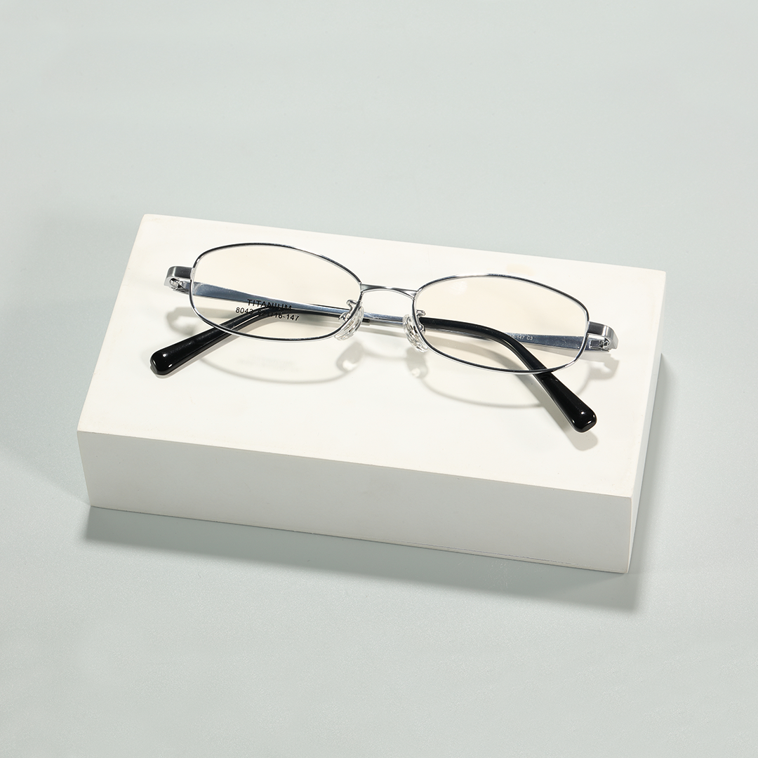 Front folded view of Rhea office siren rectangle titanium eyeglasses ET0302601 in silver