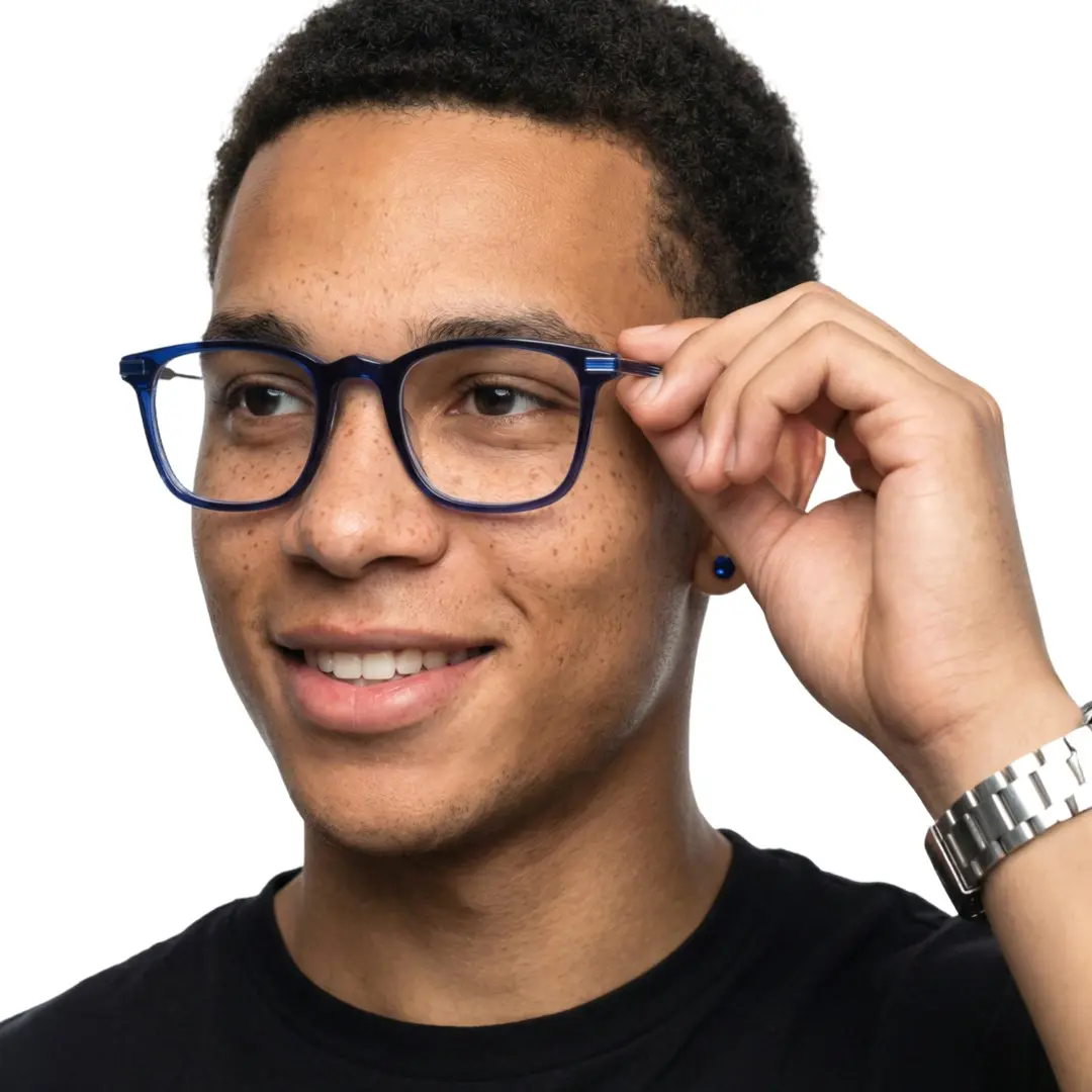 Three-quarter view of male wearing blue rectangle eyeglasses, adjusting glasses, smiling, ET0312208