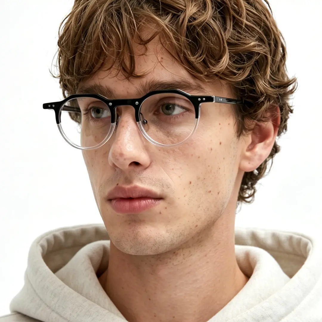 Three-quarter view of male wearing vintage blackclear geometric eyeglasses, calm expression, GA0022408