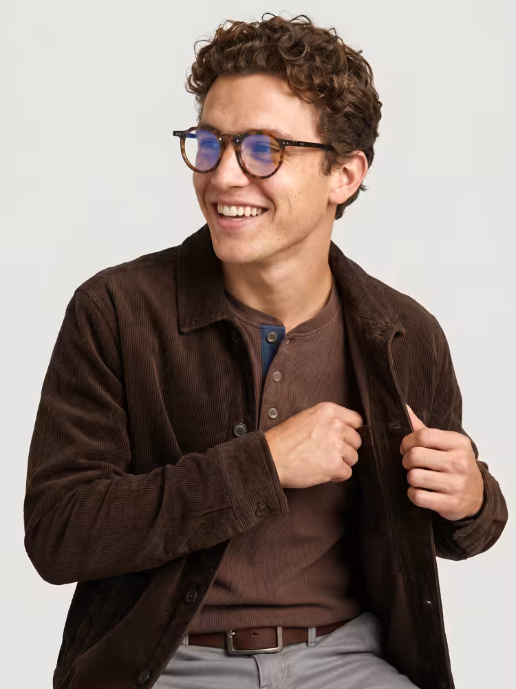 Male model wearing vintage tortoise geometric acetate eyeglasses in a studio setting. SPU: GA0022408