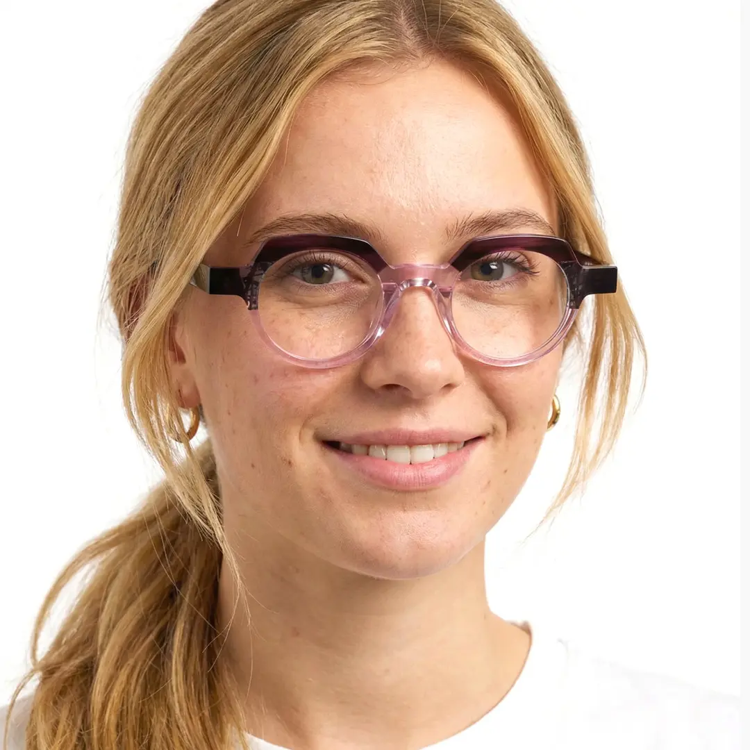Front view of female wearing pink geometric eyeglasses, natural smile, GA0032209