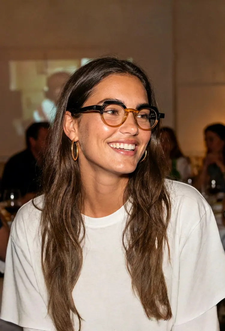 Female model wearing vintage brown geometric acetate eyeglasses at an indoor social event. SPU: GA0032209