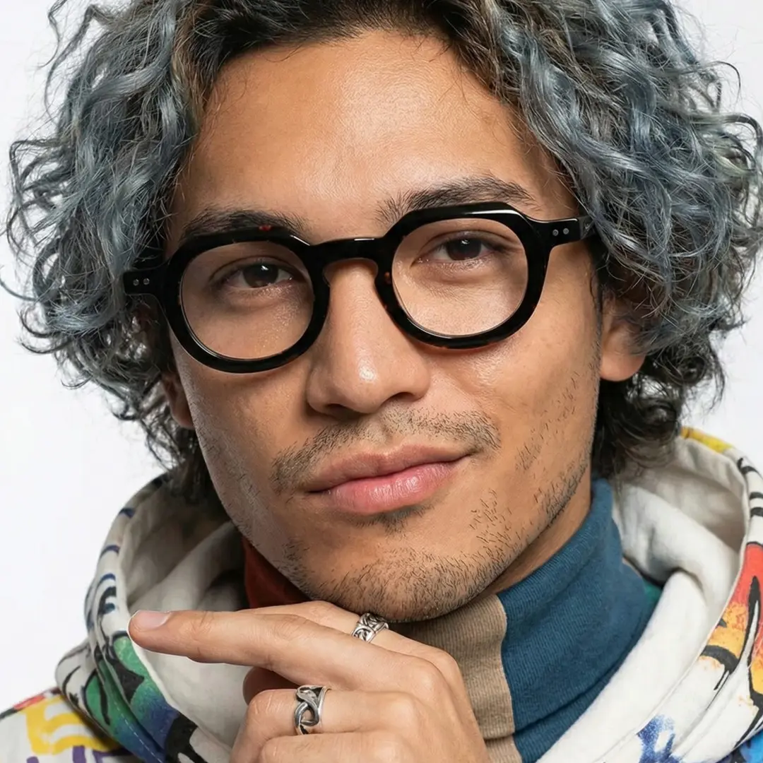 Front view of male wearing tortoise geometric eyeglasses, confident expression, GA0032301