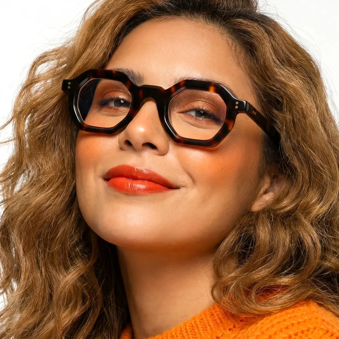 Front view of female wearing tortoise geometric eyeglasses, confident expression, GA0052310