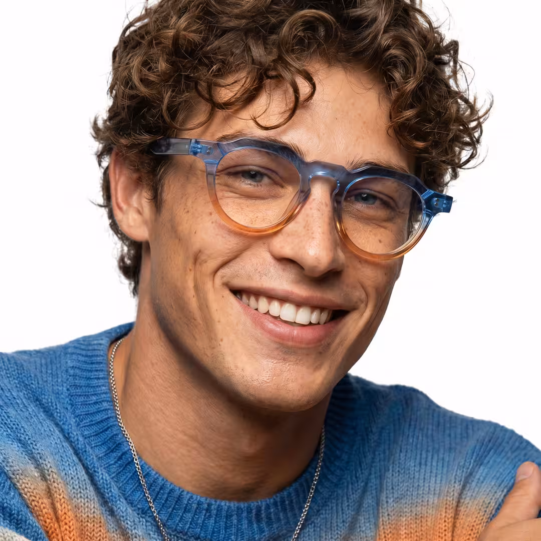 Male wearing colorful silver blue geometric acetate eyeglasses, smiling. SPU: GA0072310