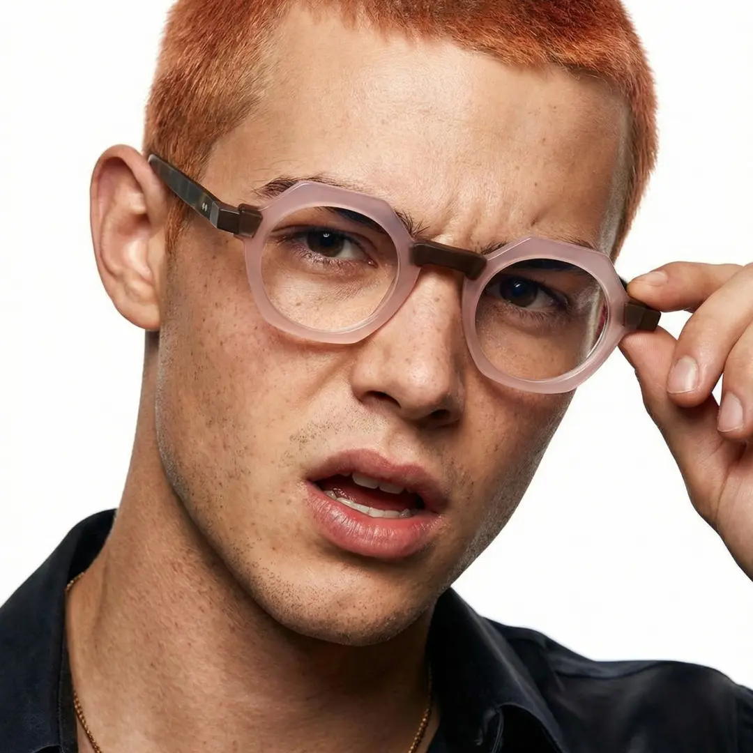 Front view of male wearing vintage pink geometric eyeglasses, touching frame, various expressions, GA0122209
