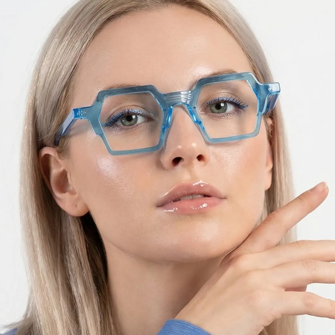 Front view of female wearing blue geometric eyeglasses, relaxed expression, GA0132302