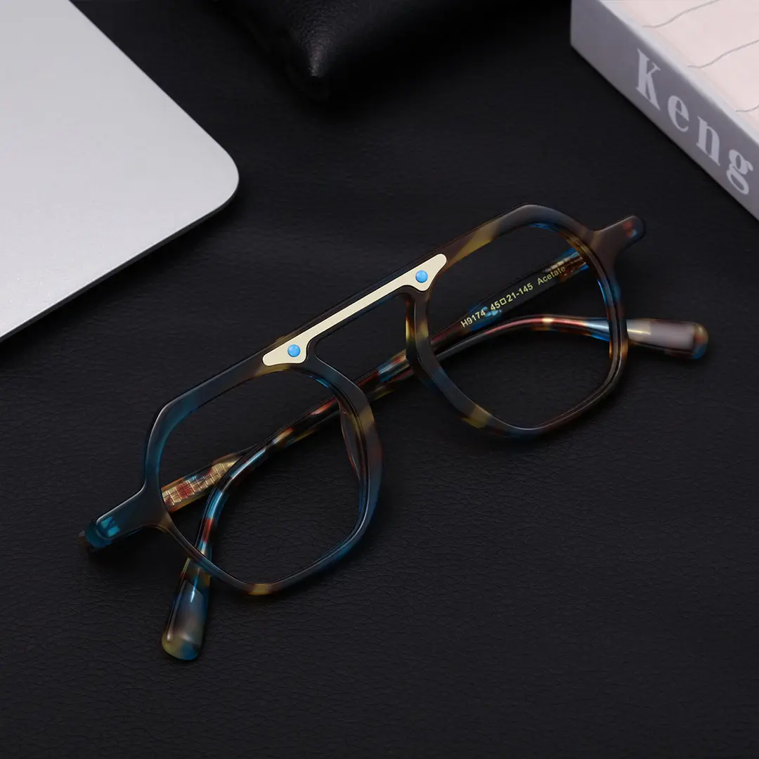 Scene close-up view of Ortiz geometric acetate eyeglasses GA0152308 in blue tortoise
