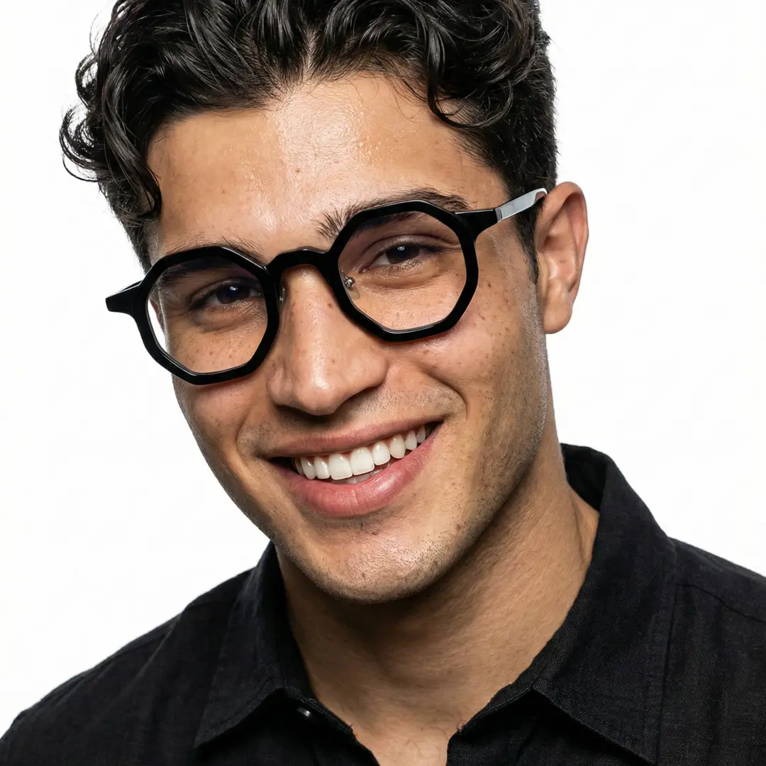 Front view of male wearing black geometric eyeglasses, smiling, GA0162302