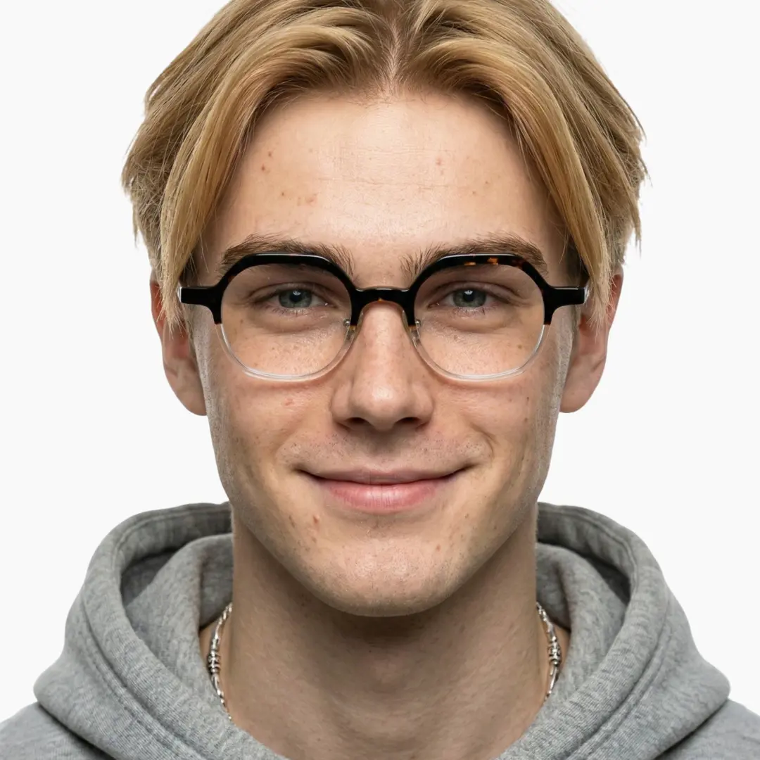 Front view of male wearing vintage tortoise geometric eyeglasses, smiling, GA0182209