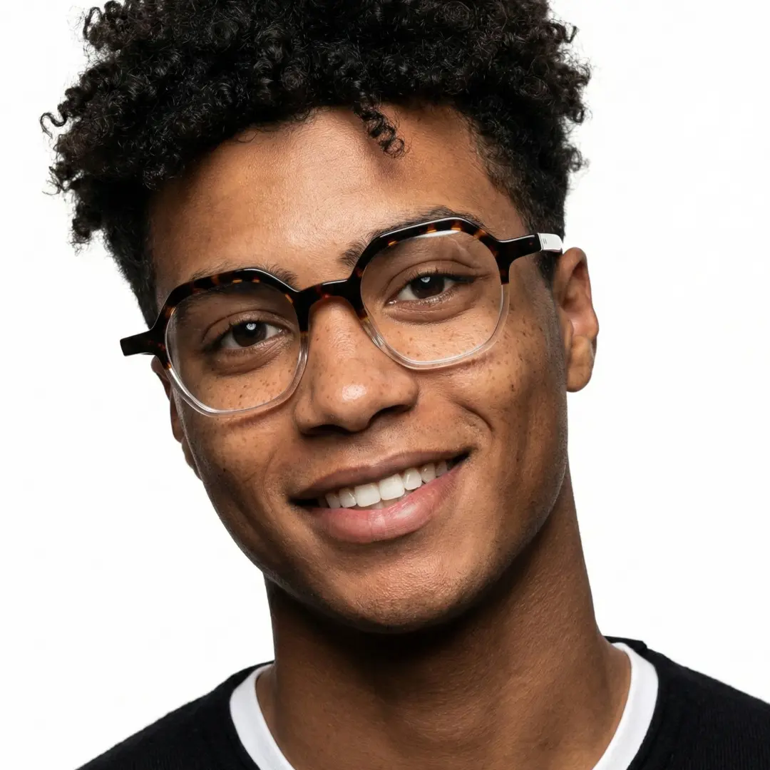 Front view of male wearing vintage tortoise geometric eyeglasses, natural smile, GA0182209