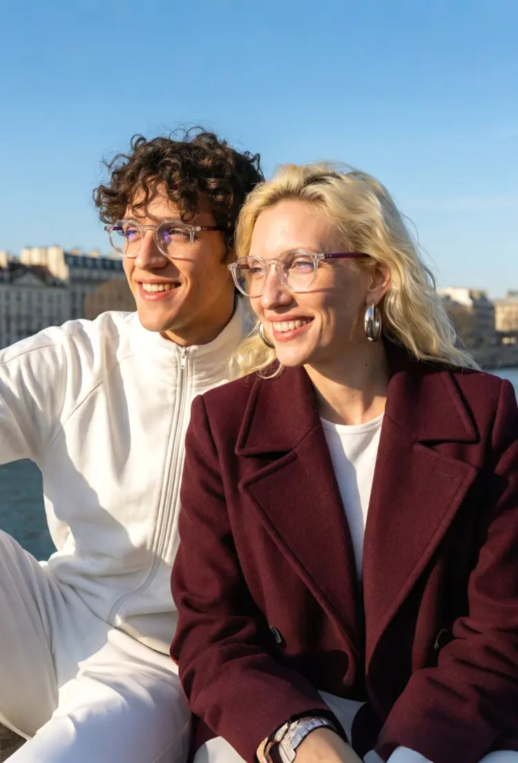 Couple models wearing everyday clear geometric acetate eyeglasses outdoors in a bright and sunny setting. SPU: GA0212403