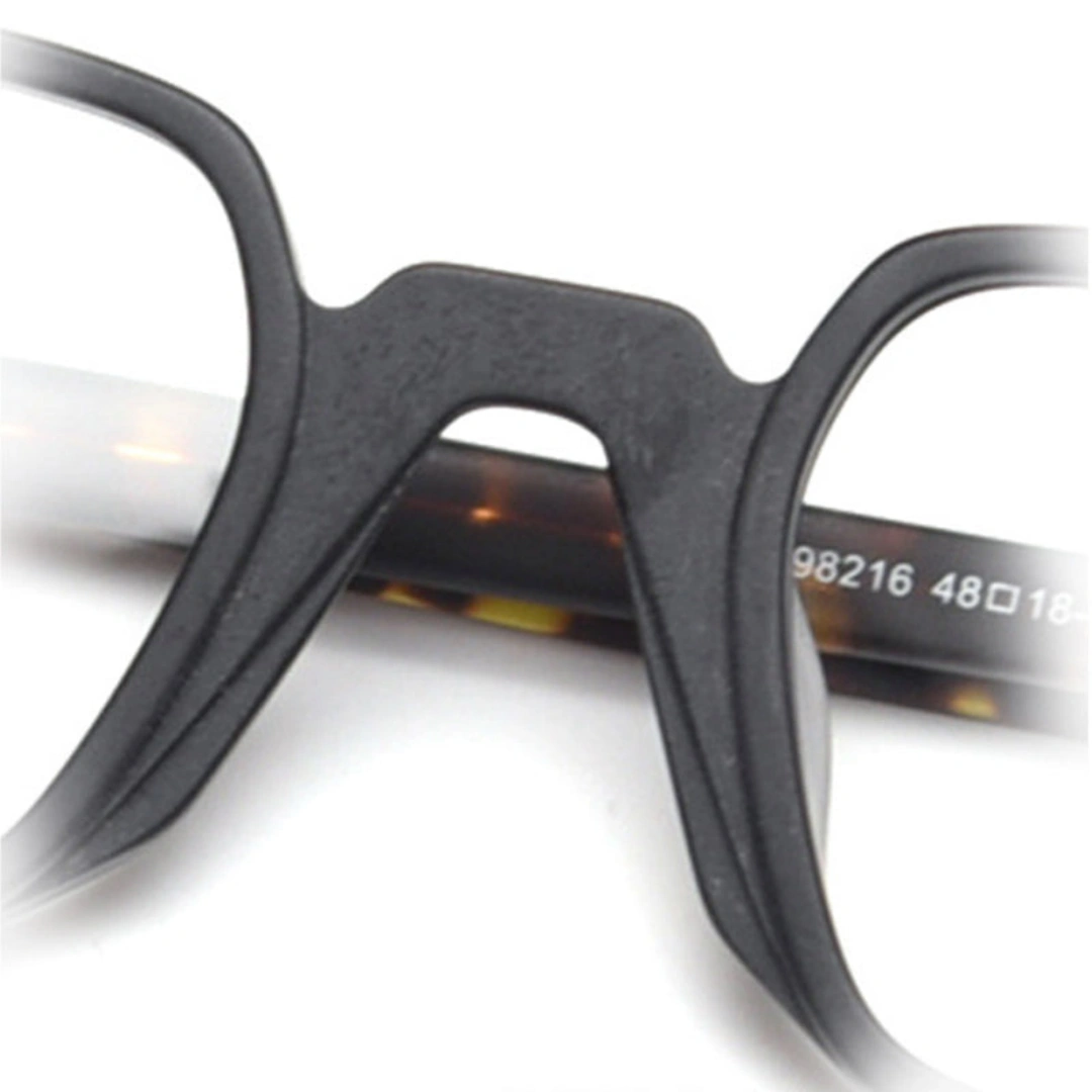 Integrated nose pad detail of Feronia geometric acetate eyeglasses GA0242306 in black