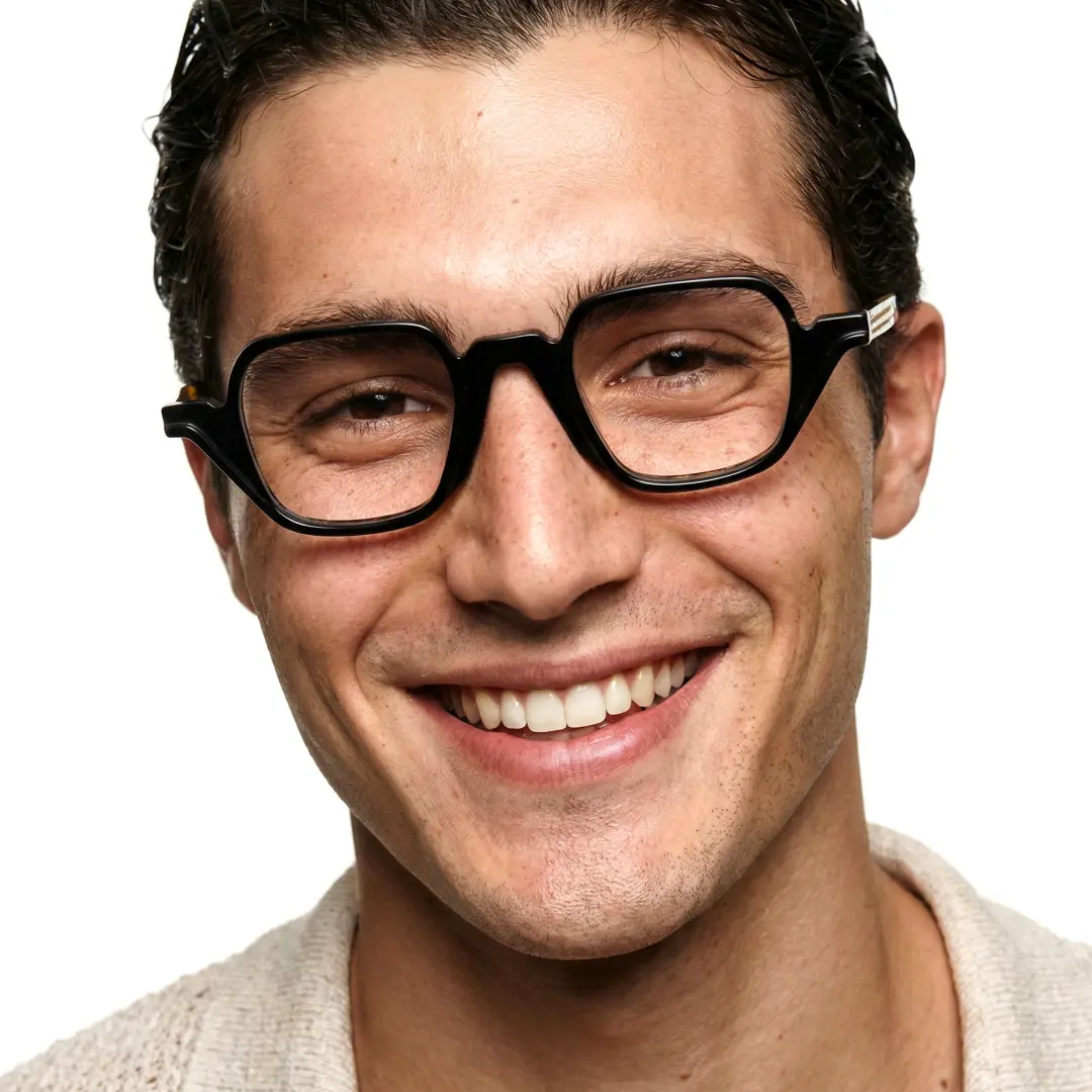 Front view of male wearing vintage black geometric eyeglasses, smiling, GA0242306