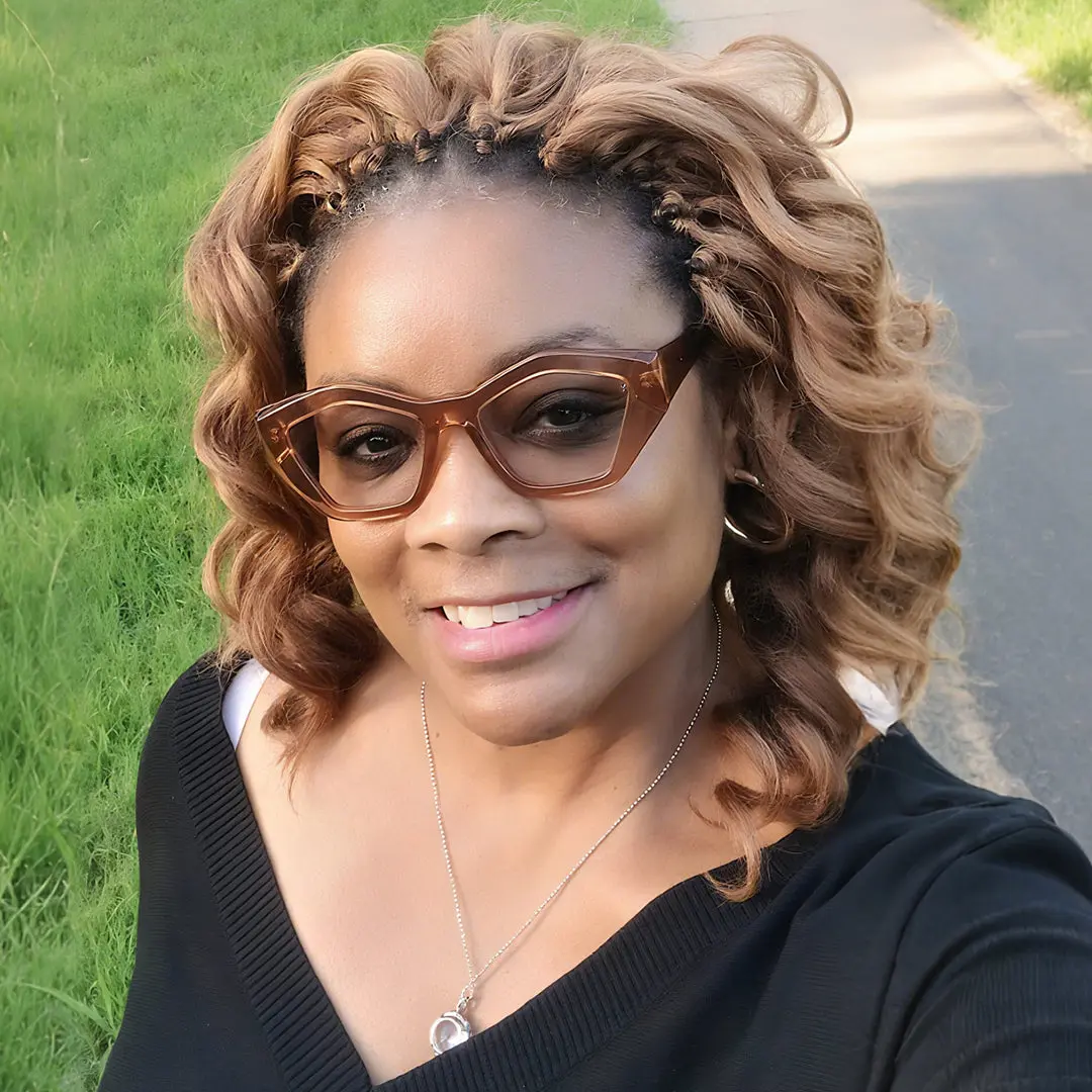 Front view of female wearing brown geometric eyeglasses, natural smile, GA0302411
