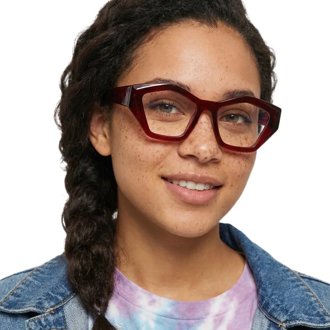 Front view of female wearing red geometric eyeglasses, smiling, GA0302411