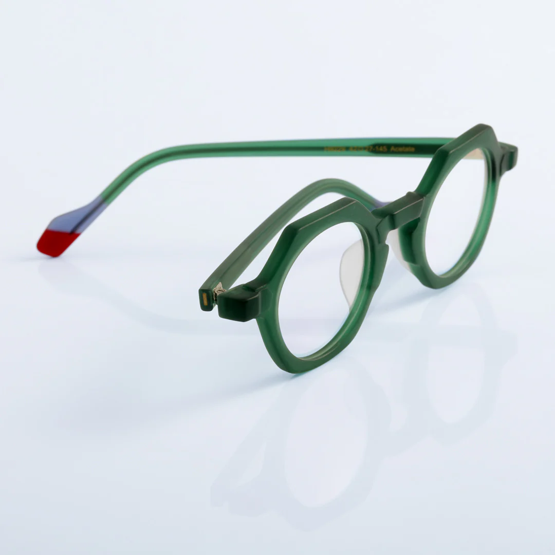 Scene close-up view of Byeo vintage geometric acetate eyeglasses in green. SPU: GA0382302