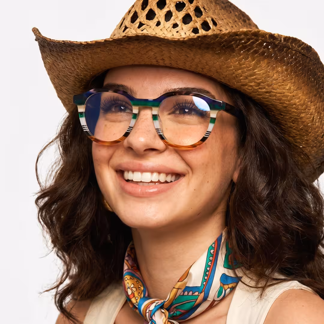 Female wearing colorful multicolor geometric acetate eyeglasses, smiling while looking away. SPU: GA0412605