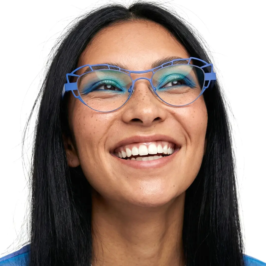 Close-up view of female wearing blue geometric eyeglasses, big smile, GM0062212