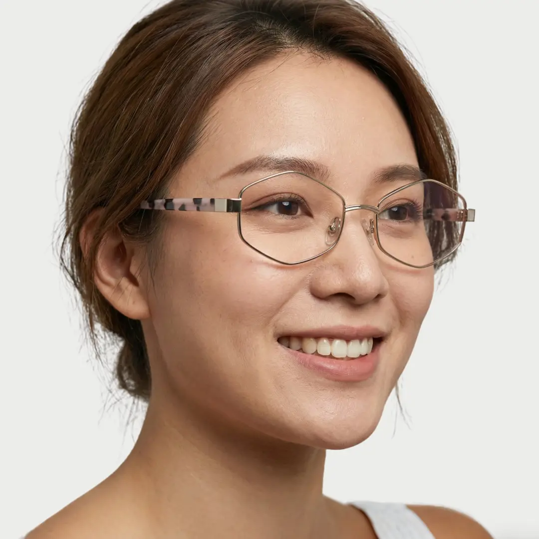 Looking away view of female wearing fashion clear geometric eyeglasses, smiling, GM0062601