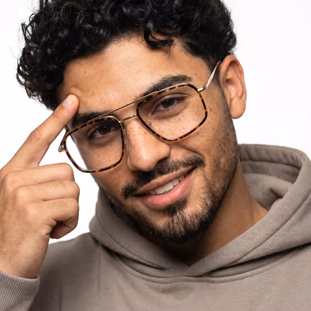 Male wearing vintage tortoise geometric metal eyeglasses, natural smile. SPU: GM0072605