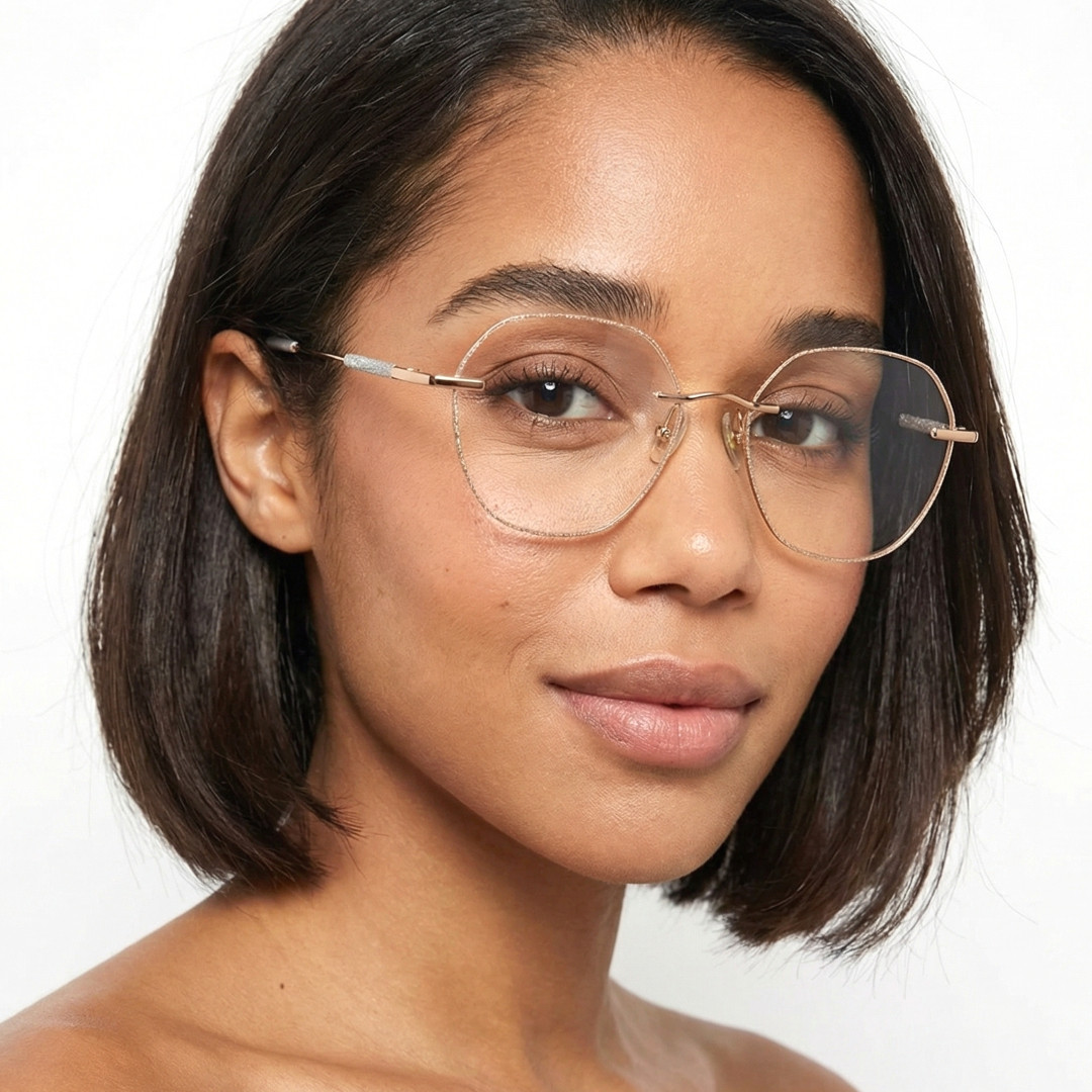 Slightly angled view of female wearing gold geometric eyeglasses, natural expression, GM0132410