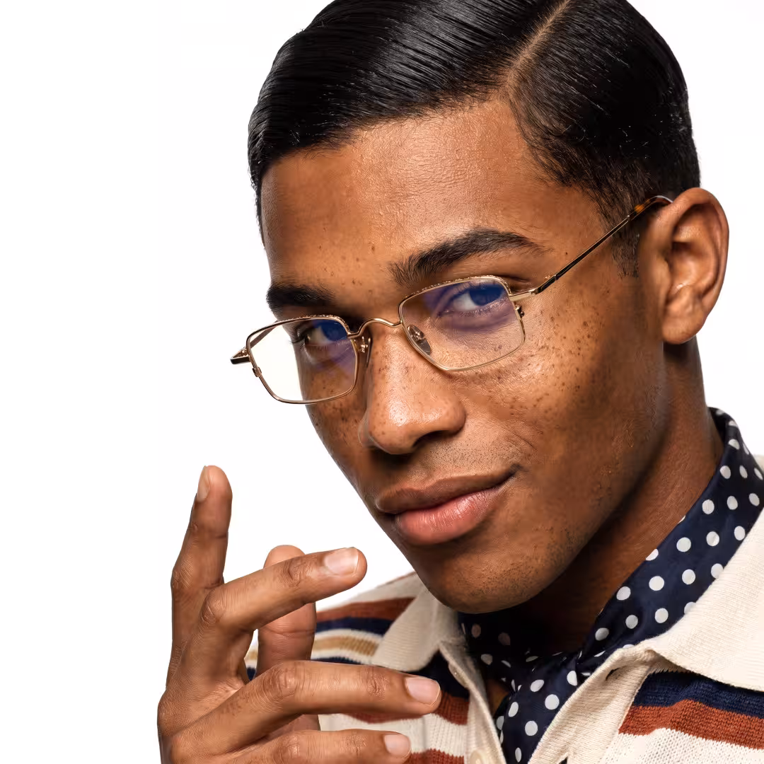 Male wearing vintage gold geometric metal eyeglasses, smiling. SPU: GM0182605
