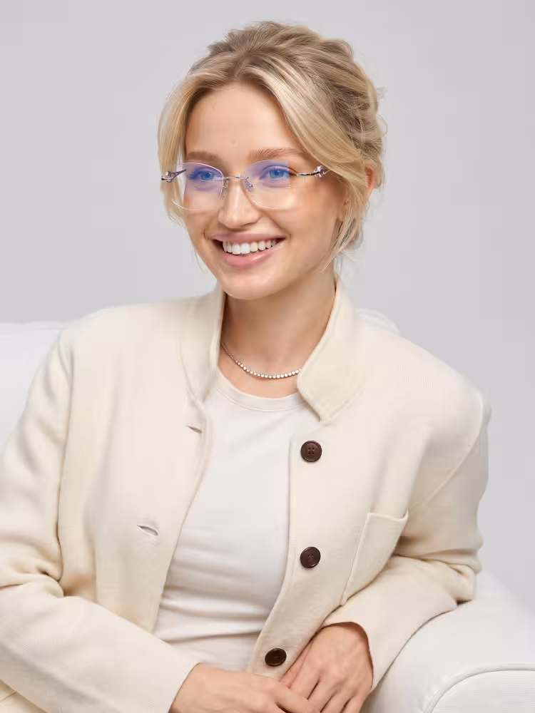 Female model wearing luxury silver geometric metal eyeglasses in a clean studio setting. SPU: GM0282604
