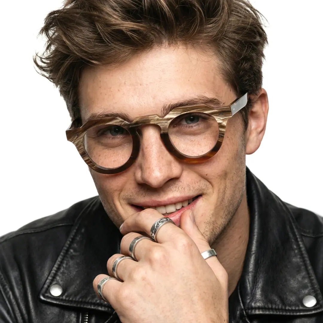 Front view of male wearing brown geometric natural ox horn handcrafted eyeglasses, resting chin on hand, soft smile, GO0272511