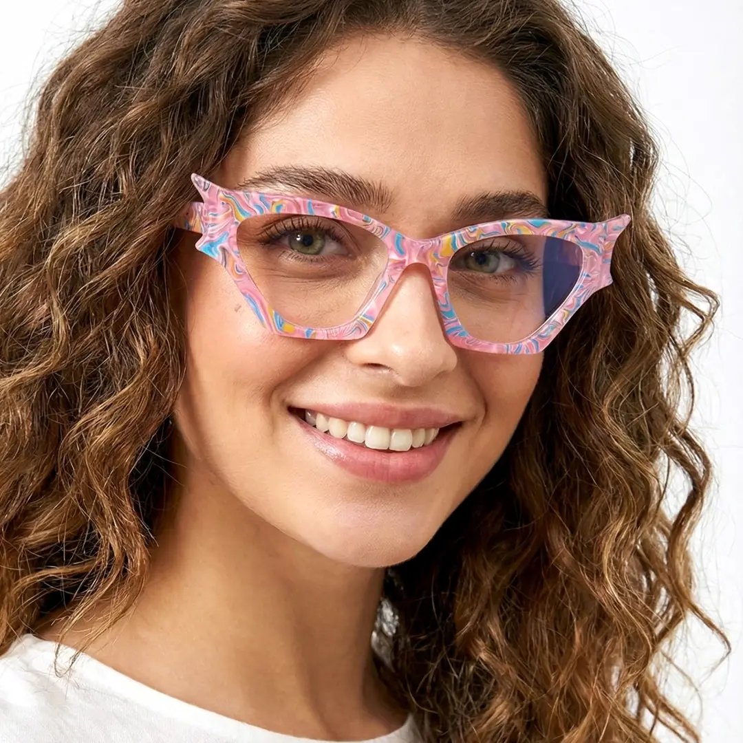 Face close-up view of female wearing pink geometric eyeglasses, friendly smile, GP0092408