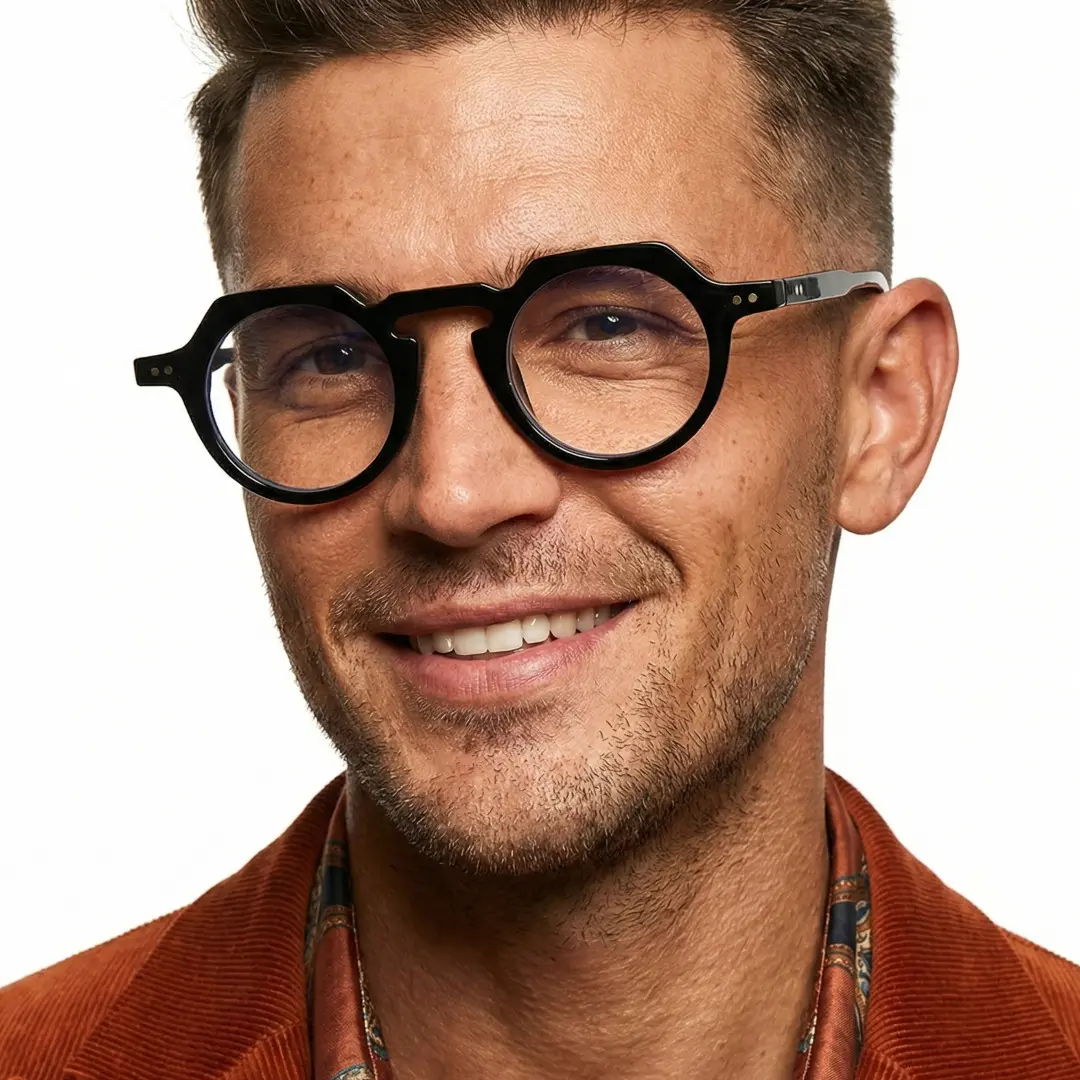 Front view of male wearing vintage black geometric eyeglasses, natural smile, GP0122308