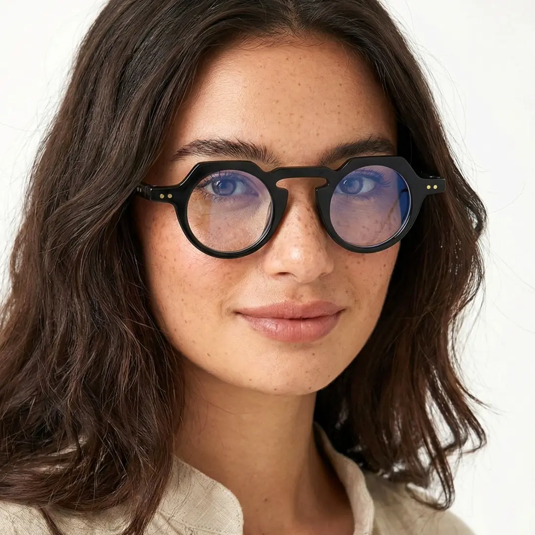 Slightly angled view of female wearing vintage black geometric eyeglasses, natural expression, GP0122308