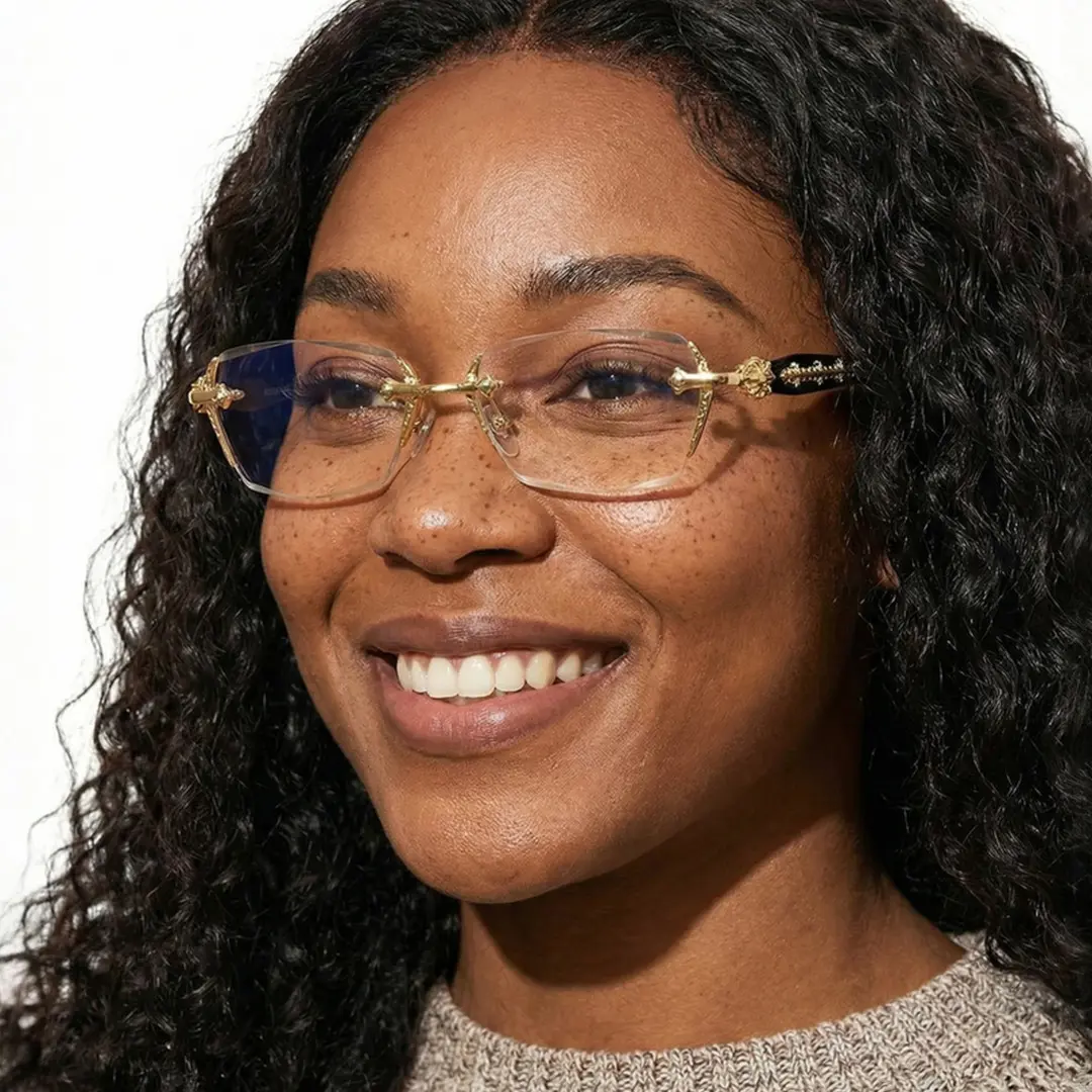 Three-quarter view of female wearing gold geometric eyeglasses, friendly smile, GP0322512