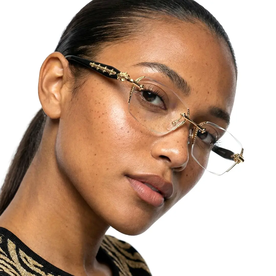 Face close-up view of female wearing gold geometric eyeglasses, Tilting head, neutral expression, GP0322512