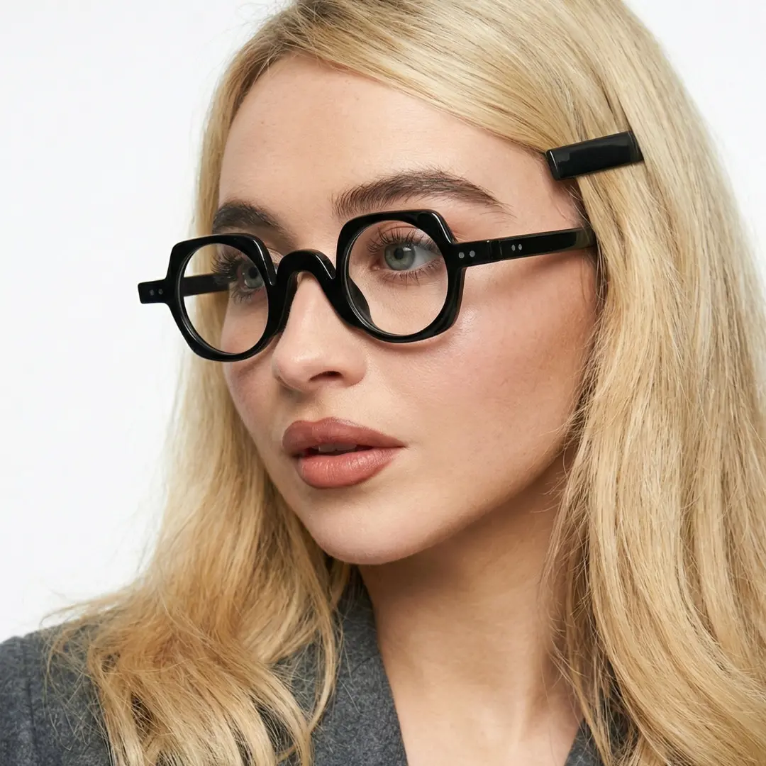 Looking away view of female wearing black geometric eyeglasses, soft smile, GP0342411