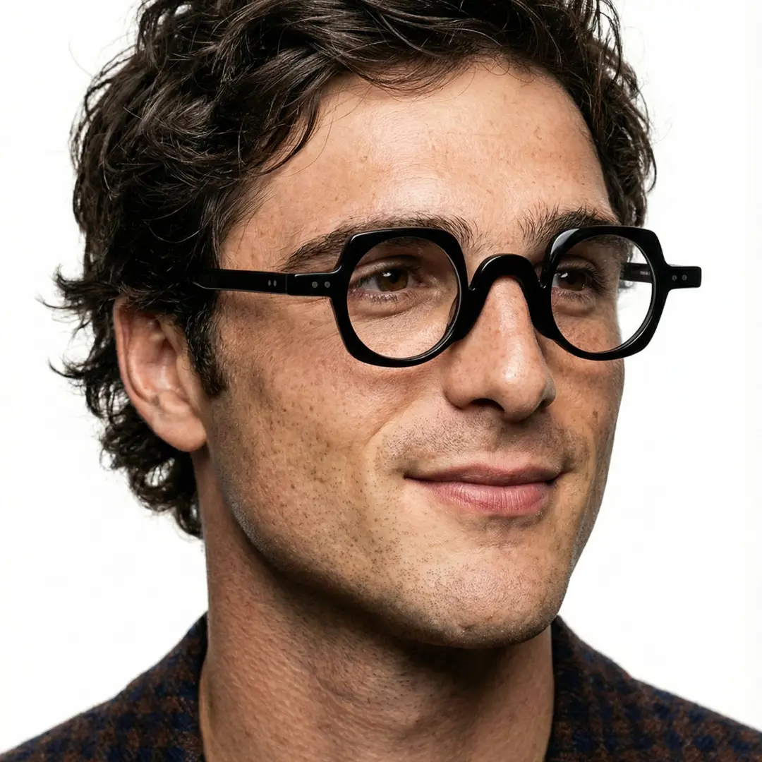 Three-quarter view of male wearing vintage black geometric eyeglasses, natural smile, GP0342411