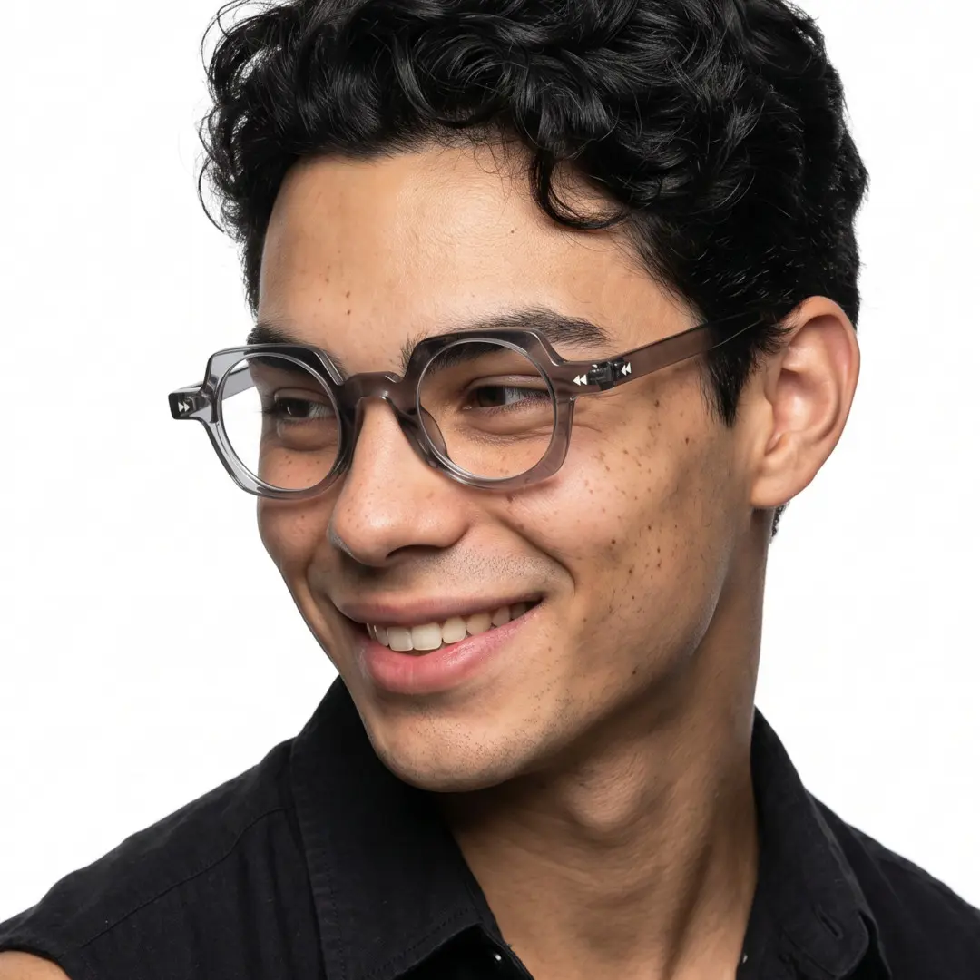Three-quarter view of female wearing vintage grey geometric eyeglasses, smiling, GP0342411