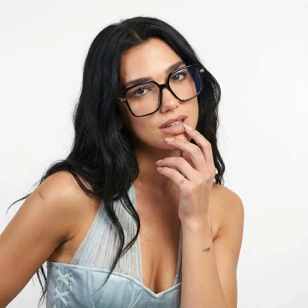 Slightly angled view of female wearing black geometric eyeglasses, natural expression, GR0032510