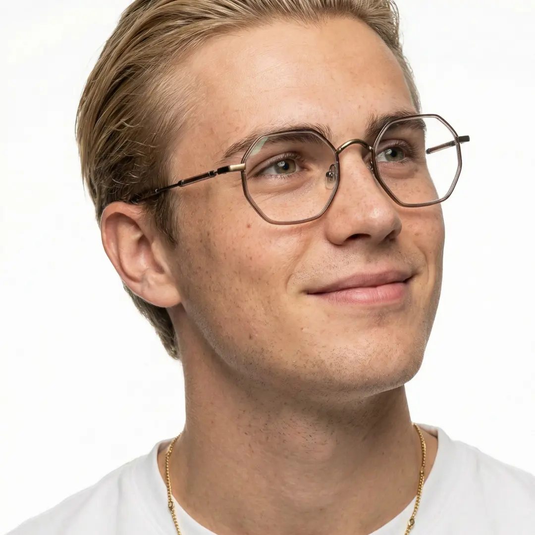 Looking away view of male wearing brown geometric eyeglasses, smiling, GR0102308