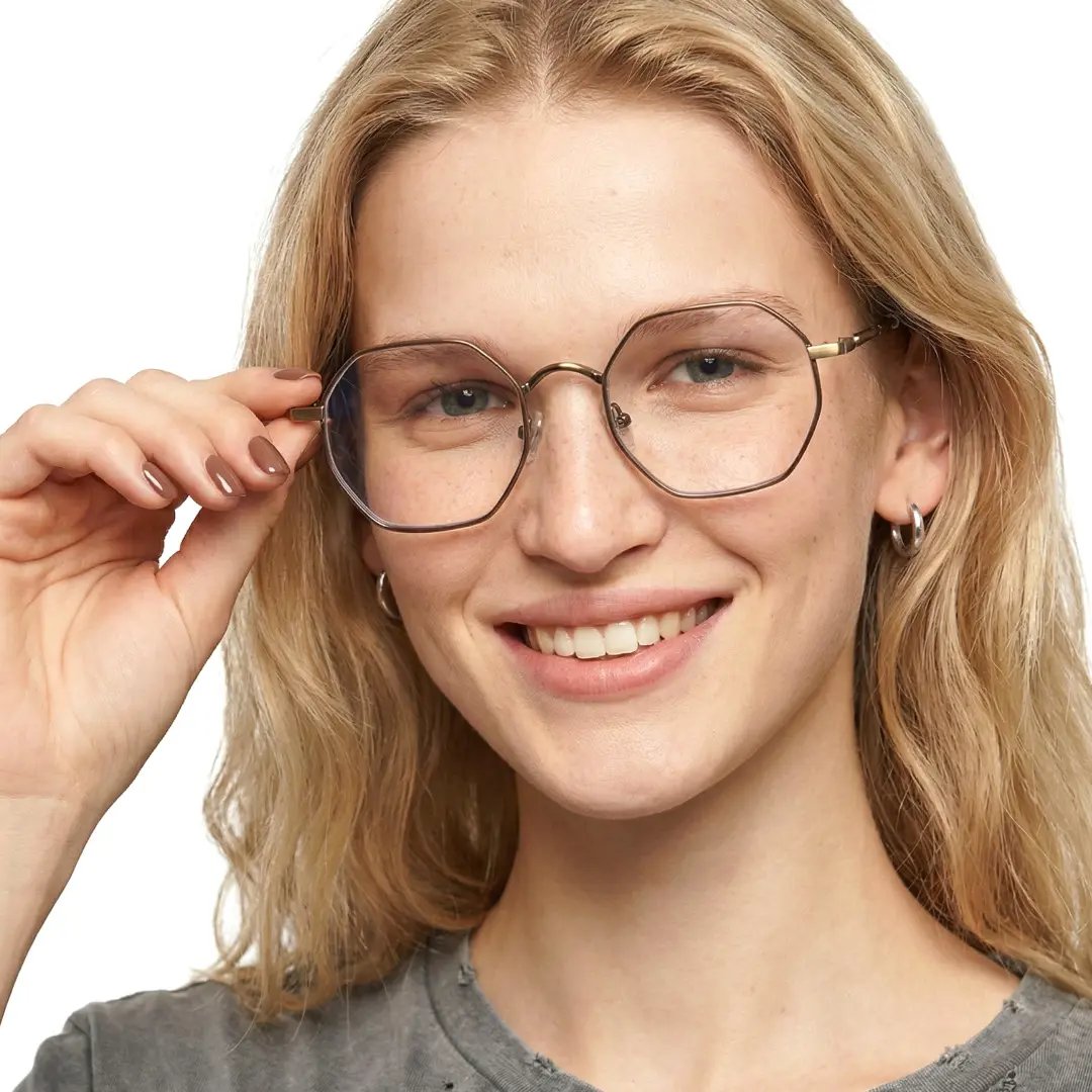 Looking straight ahead view of female wearing brown geometric eyeglasses, adjusting glasses, smiling, GR0102308