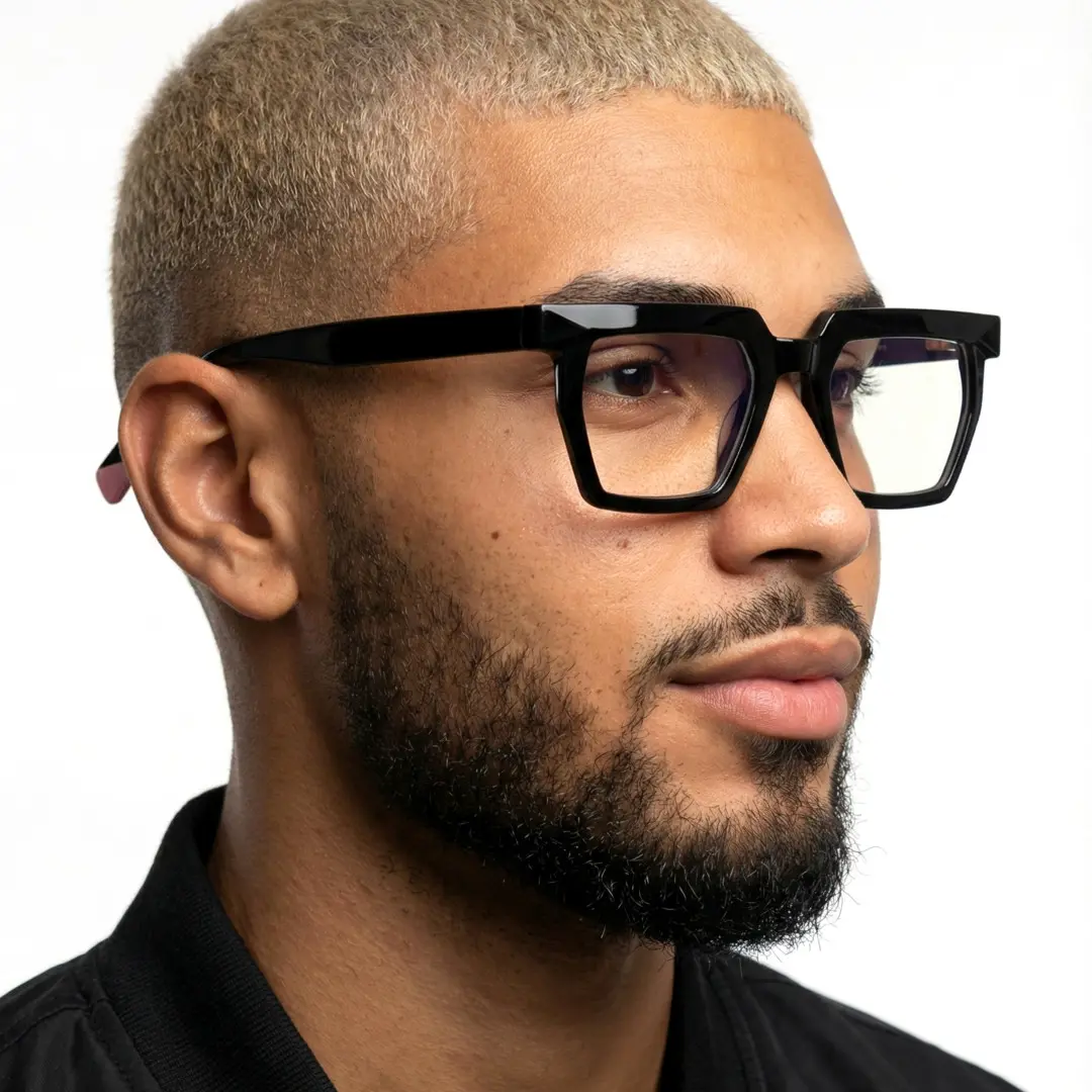 Three-quarter view of male wearing black geometric eyeglasses, neutral expression, GR0432302