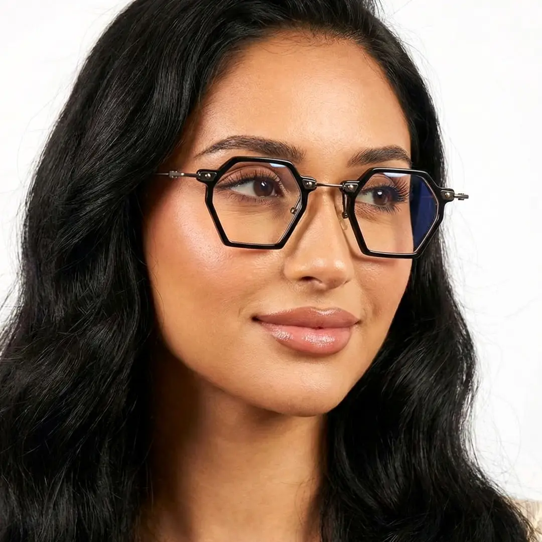 Looking away view of female wearing black geometric eyeglasses, neutral expression, GT0032306