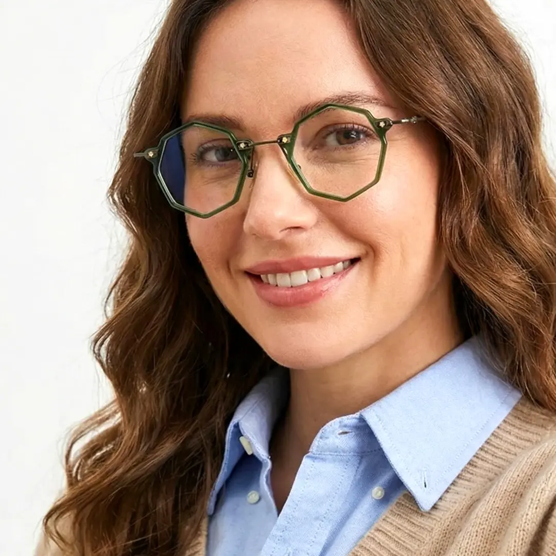 Slightly angled view of female wearing steampunk green geometric eyeglasses, smiling, GT0332411