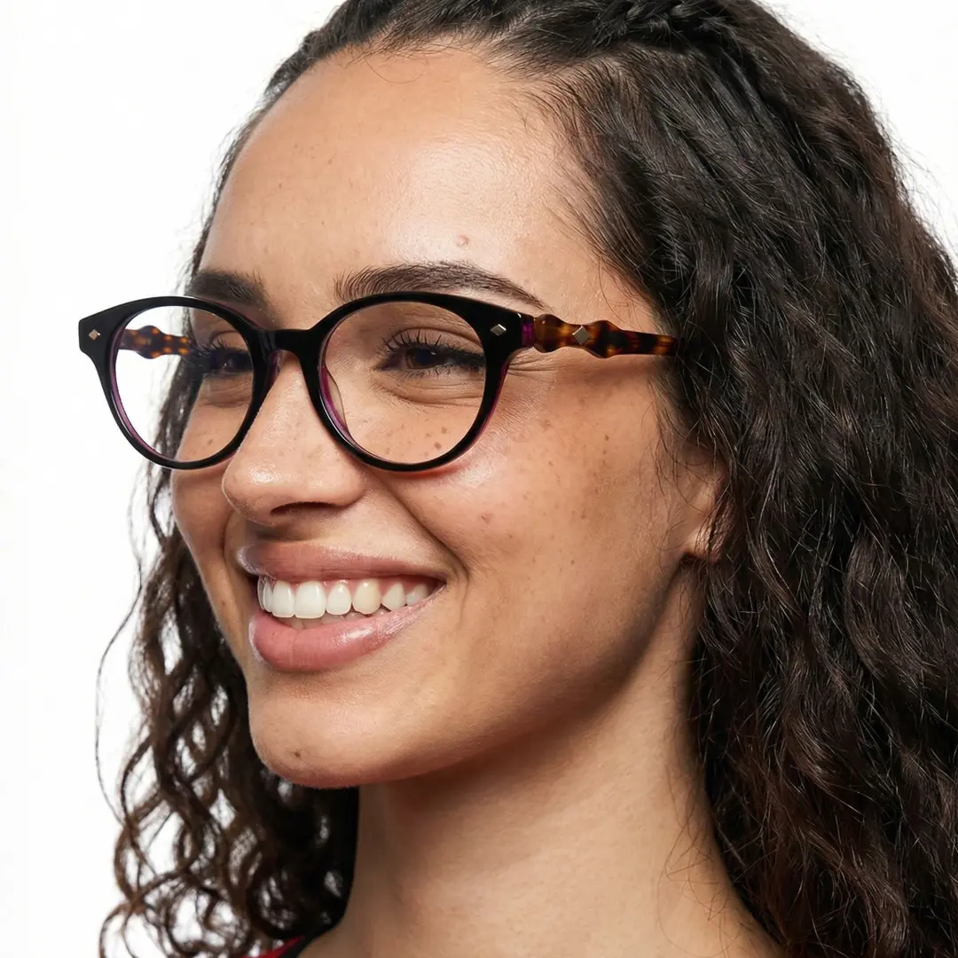 Looking away view of female wearing tortoise oval eyeglasses, friendly smile, OA0302501