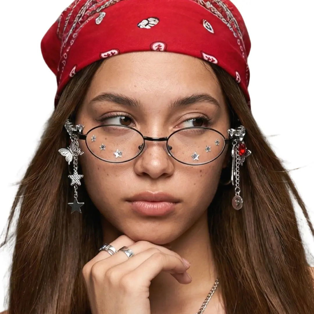 Front view of female wearing red oval eyeglasses, resting chin on hand, neutral expression, OM0062511
