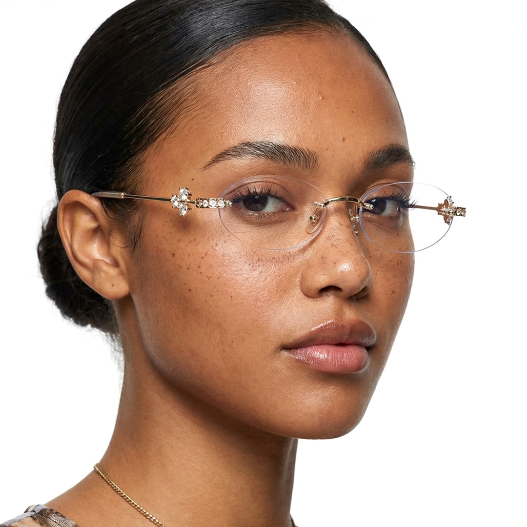 Profile view of female wearing fashion gold oval eyeglasses, neutral expression, OM0172601