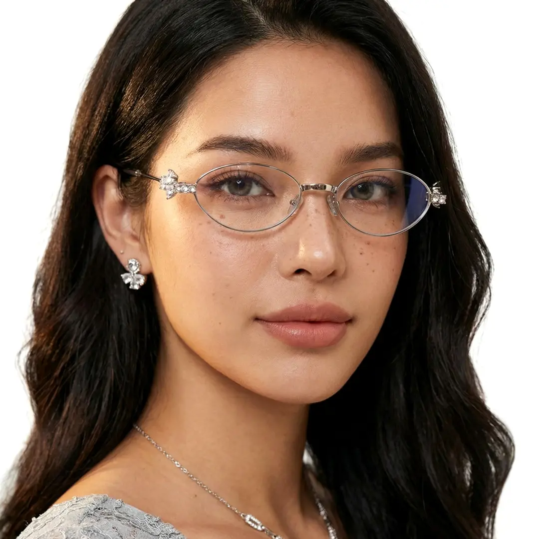 Close-up view of female wearing y2k silver oval eyeglasses, natural expression, OM0252601