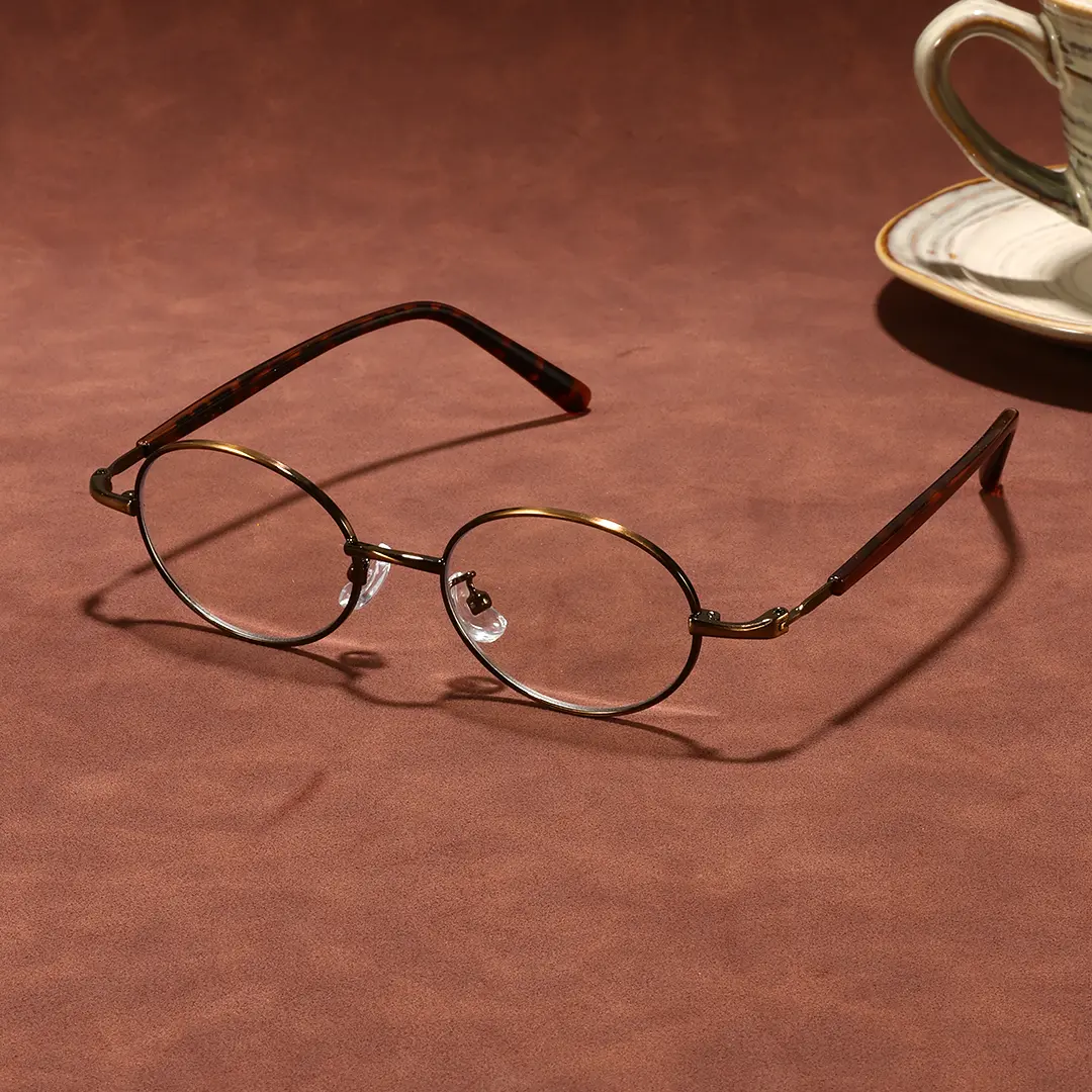 Scene view of Marlow oval metal eyeglasses OM0272508 in brown