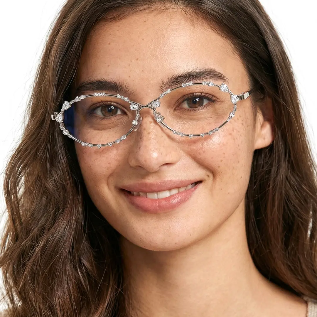 Front view of female wearing silver oval eyeglasses, looking straight ahead, smiling, OM0292512
